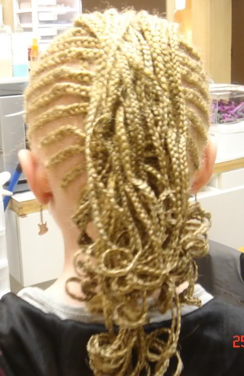 Photo of long blonde cornrow hairstyle for girls. 