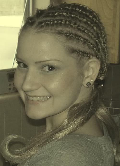 Image of a white girl with long cornrow. 