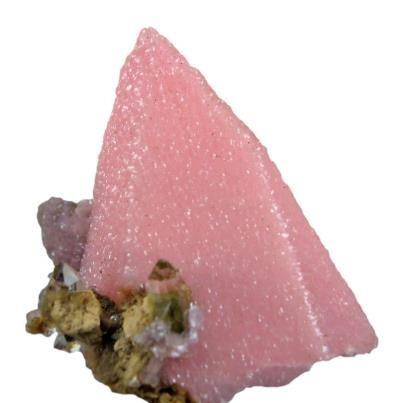 PSEUDOMORPHSRhodochrosite after CalciteA rare razor-sharp scalenohedron of Rhodochrosite pseudomorph after the Calcite (which it has replaced). The spearpoint crystal is 2.1 cm in length and the color is a lustrous and translucent, vivi...d, pink color. An added accent is the small , sparkling cluster gemmy quartz crystals on the lower left. Ex Richard Heck collection. Size 2.1 x 1.8 x 1.5 cm. From Taxco, Guerrero, Mexico. Credit: Rob LavinskySee more.